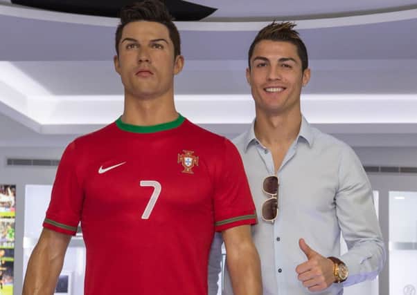 Ronaldo poses with a wax statue of himself at the opening of his museum. Picture: Gregorio Cunha