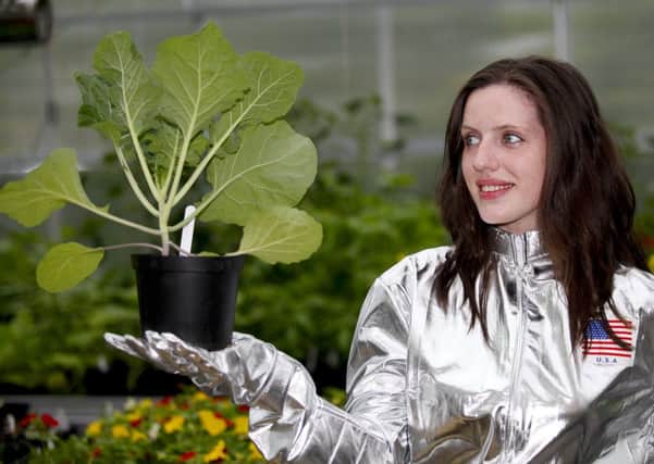 Student Opal Rowe with a cabbage plant grown to further the S.P.A.C.E project. Picture: Scott Louden