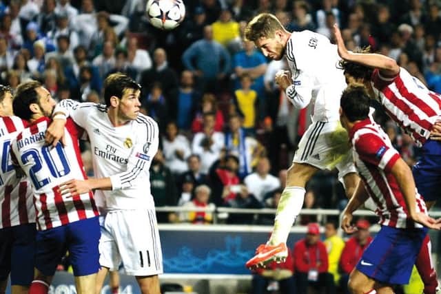 Turning point: Sergio Ramos soars to level the scores in the 93rd minute. Picture: Getty Images