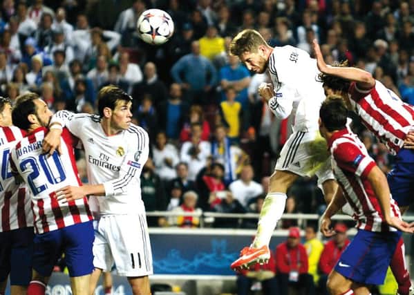 Turning point: Sergio Ramos soars to level the scores in the 93rd minute. Picture: Getty Images
