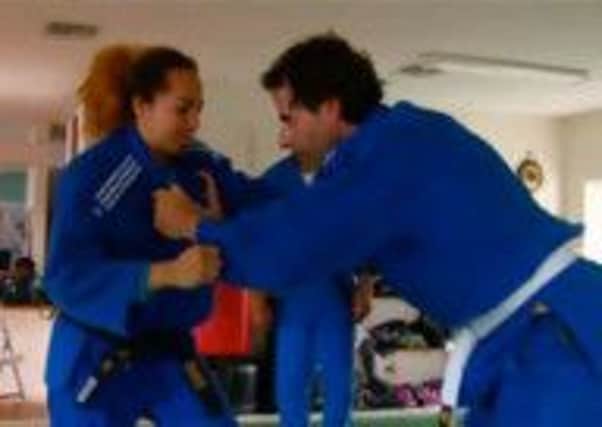 Broadcaster Mark Beaumont grapples with judo player Cynthia Rahming on the BBC documentary. Picture: Contributed