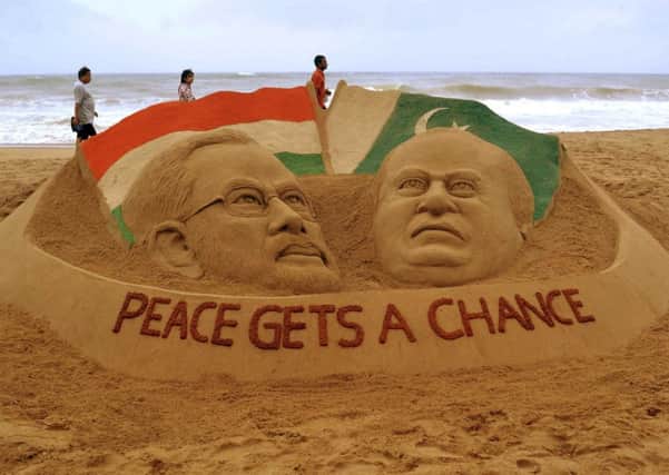 Sculpture of Modi and Sharif in Puri by sand artist Sudarshan Patnaik. Picture: Reuters