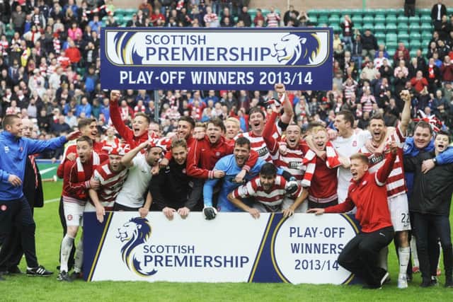 The jubilant Hamilton Accies players celebrate clinching promotion to the SPFL. Picture: Greg Macvean