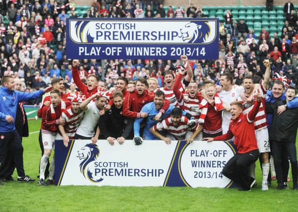 The jubilant Hamilton Accies players celebrate clinching promotion to the SPFL. Picture: Greg Macvean