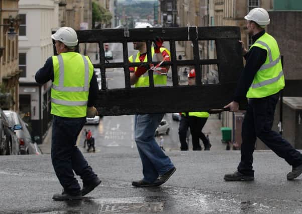 GSA staff work alongside the fire brigade and Historic Scotland to salvage artwork. Picture: Hemedia