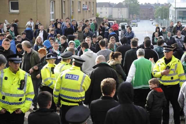 Hibs fans demonstrate at Easter Road after the club were relegated on Sunday. Picture: Greg Macvean