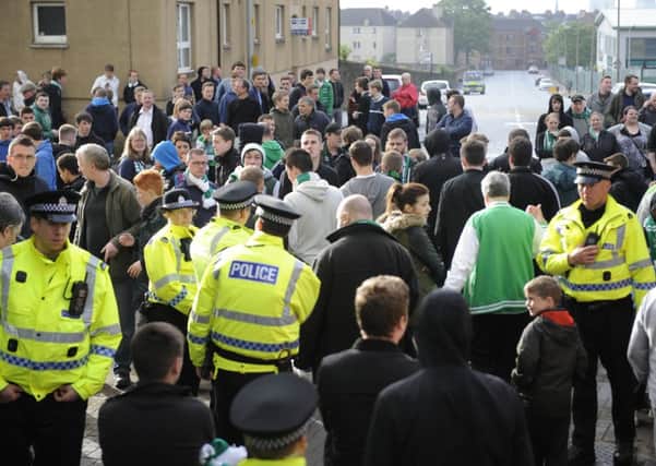 Hibs fans demonstrate at Easter Road after the club were relegated on Sunday. Picture: Greg Macvean