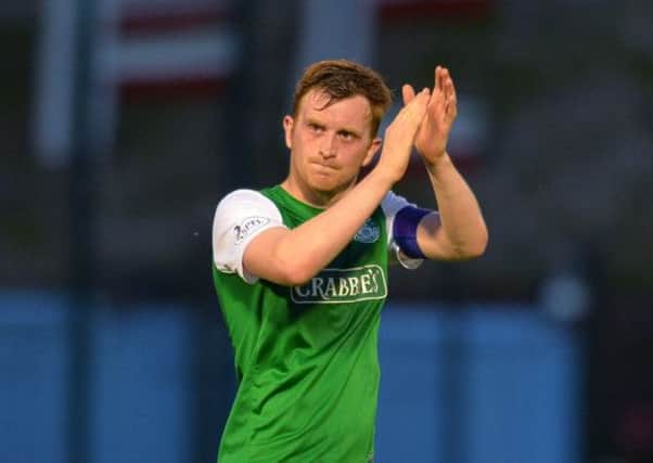 Liam Craig applauds the Hibs fans after their 2-0 first leg play-off win over Hamilton. Picture: Getty