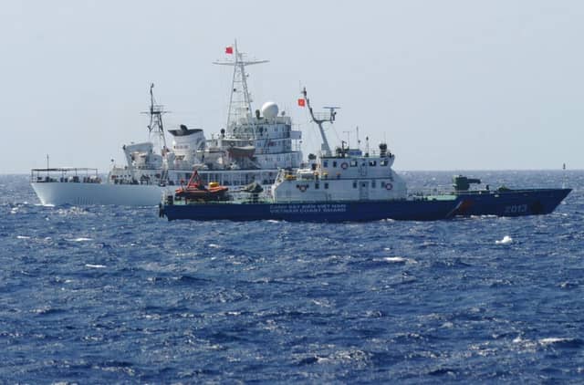 Chinese and Vietnamese coastguard vessels near the oil rig. Picture: Getty
