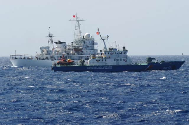 Chinese and Vietnamese coastguard vessels near the oil rig. Picture: Getty