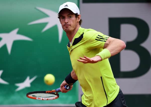 Andy Murray returns a shot during his men's singles match against Andrey Golubev. Picture: Getty