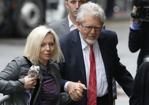 Rolf Harris arrives with his daughter Bindi at Southwark Crown Court. Picture: Reuters