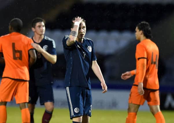 Jordan McGhee looks shell-shocked after the Dutch U21s putsix6 past their Scottish counterparts. Picture: SNS