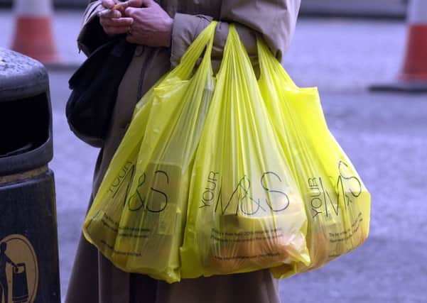 A minimum charge of 5p for plastic carrier bags will be introduced in October. Picture: TSPL