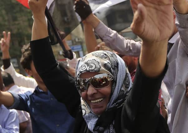 A woman celebrates Abdel Fattah alSisis victory in Cairos Tahrir Square yesterday. Picture: Reuters