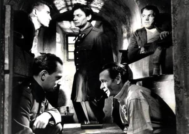 A scene from The Colditz Story, starring John Mills
