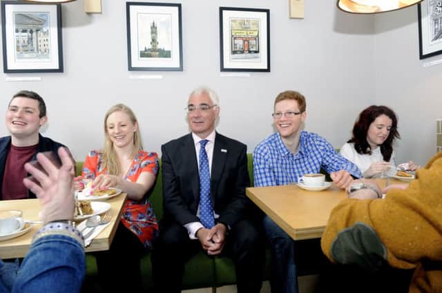 Alistair Darling takes time out for tea and cakes with a group of campaigners in Glasgow yesterday. Picture: John Devlin