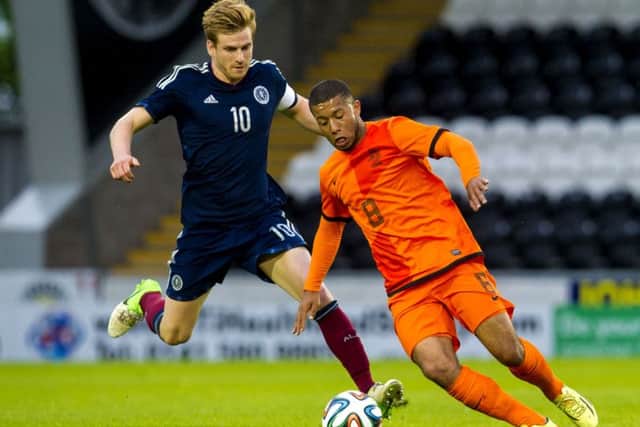 Holland U21s' Tonny Trindade De Vilhena, right, tries to keep possession from Stuart Armstrong. Picture: SNS