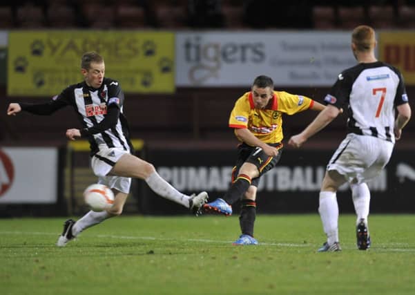 Steven Lawless hammers home one of his many goals for Partick Thistle. Picture: TSPL