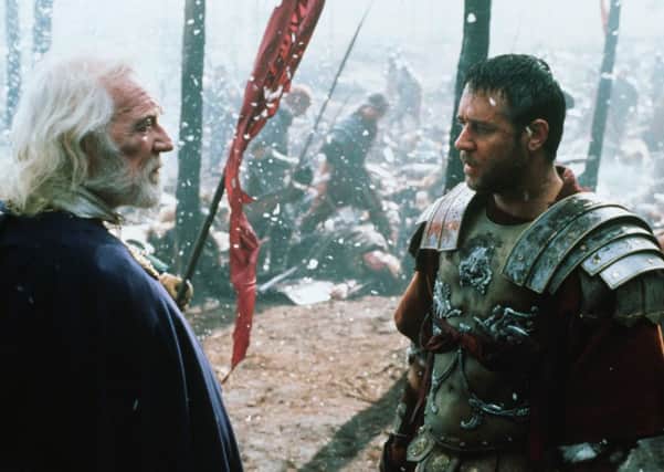 Richard Harris, left, gives Russell Crowe some stoic advice in the film Gladiator. Picture: Kobal
