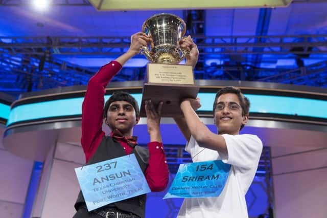 Cochampions Ansun Sujoe and Sriram Hathwar raise the championship trophy. Picture: AP