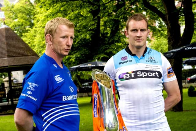 Al Kellock (right) and Leinster counterpart Leo Cullen with the RaboDirect PRO12 Trophy. Picture: SNS