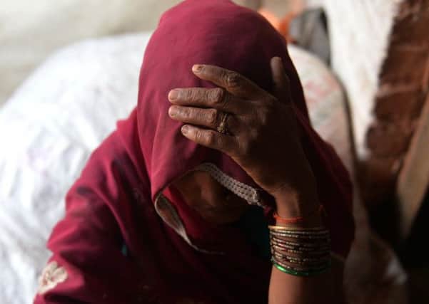 The mother of one of the gang-rape victims looks on at Katra Shahadatgunj in Badaun. Picture: Getty Images