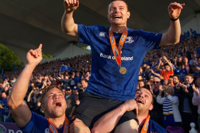 Brian O'Driscoll celebrates at the end of the last match of his career,  after Leinster retained the Pro 12 trophy. Picture: Getty