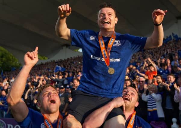 Brian O'Driscoll celebrates at the end of the last match of his career,  after Leinster retained the Pro 12 trophy. Picture: Getty