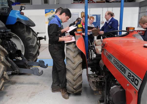 Students in Agricultural engineering take down notes from their tutor. Picture: Ian Rutherford
