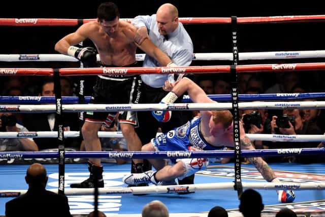 Carl Froch knocks down George Groves during the IBF and WBA World Super Middleweight Title fight. Picture: PA