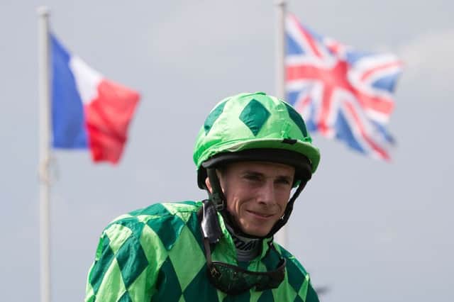 A delighted Ryan Moore enjoys the winning feeling after his terrific Prix du Jockey Club triumph. Picture: Getty