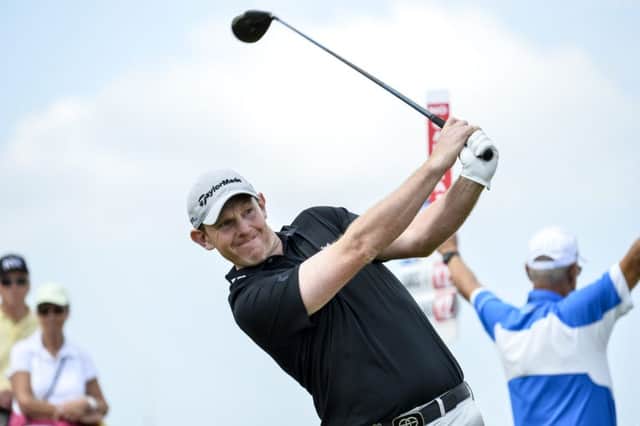 Stephen Gallacher drives at the first tee yesterday on his way to a 68 and a second-place finish in Malmo. Picture: AP