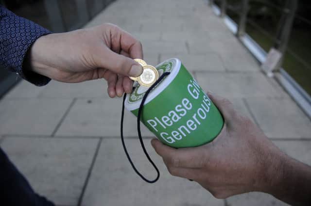 Charities are banned from collecting around Games venues. Picture: Greg Macvean