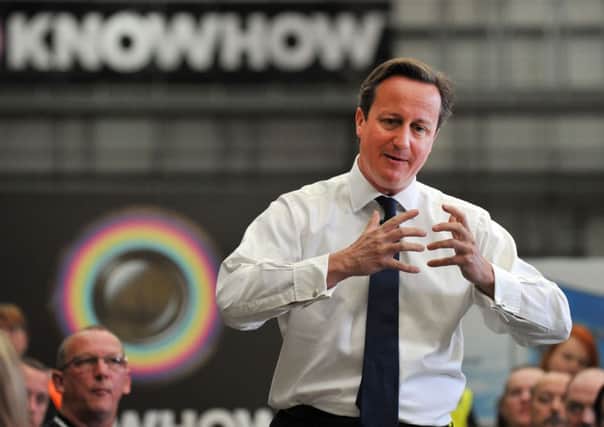 David Cameron speaks to workers at the Knowhow Warehouse in Newark. Picture: Getty