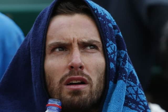 Ernests Gulbis takes a breather during his quarter-final defeat of Tomas Berdych yesterday. Picture: AP