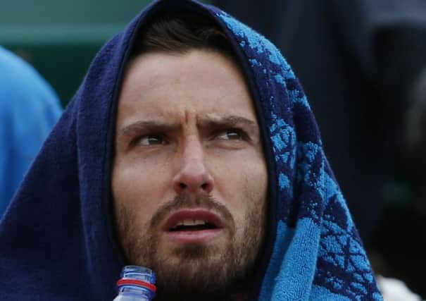 Ernests Gulbis takes a breather during his quarter-final defeat of Tomas Berdych yesterday. Picture: AP