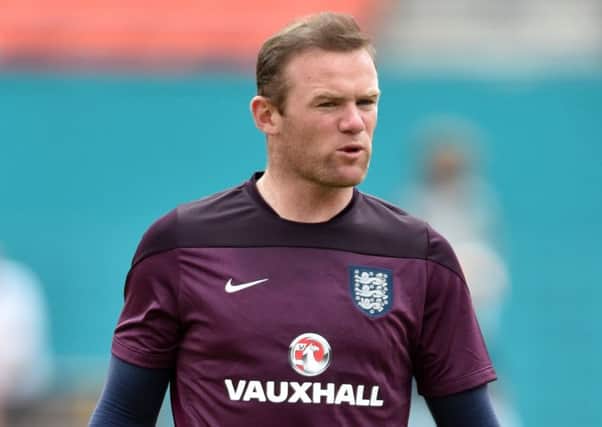 Wayne Rooney warms up during England's training session at Miami Sun Life Stadium. Picture: Getty