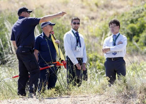 British police search an area of scrubland in Praia de Luz. Picture: Getty
