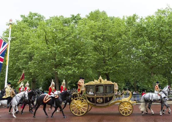 The Queen and the Duke of Edinburgh ride in the Diamond Jubilee state carriage. Picture: Getty