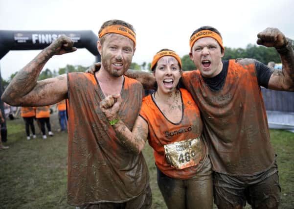 Tough Mudder competitors enjoy completing the notoriously challenging course. Picture: Phil Wilkinson