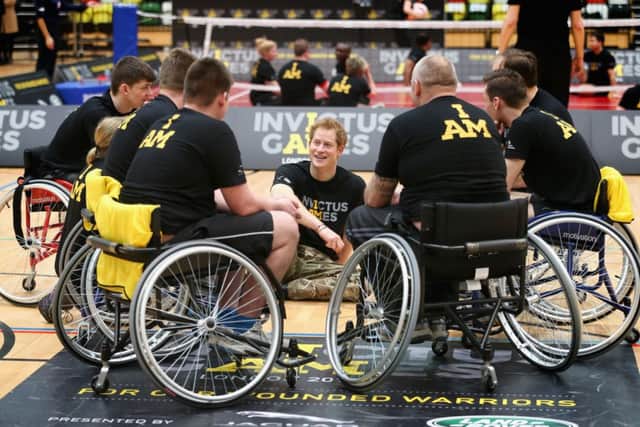 Prince Harry chats to wheelchair basketball players at the launch for the Invictus Games. Picture: Getty
