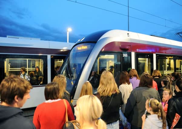One Direction fans wait for a tram to stop after the band's gig at Murrayfield Stadium. Picture: Lisa Ferguson