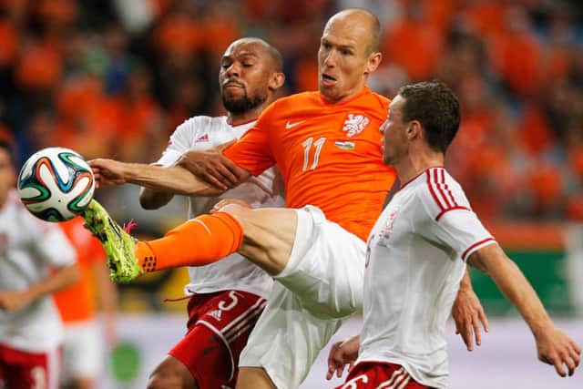 Arjen Robben attempts to navigate his way past Daniel Gabbidon and James Chester. Picture: Getty