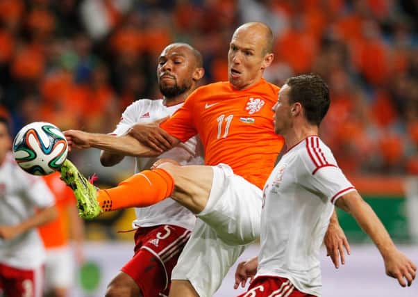 Arjen Robben attempts to navigate his way past Daniel Gabbidon and James Chester. Picture: Getty