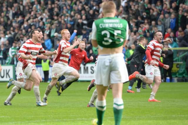 Hamilton celebrate beating Hibs in their Premiership play-off. Picture: SNS