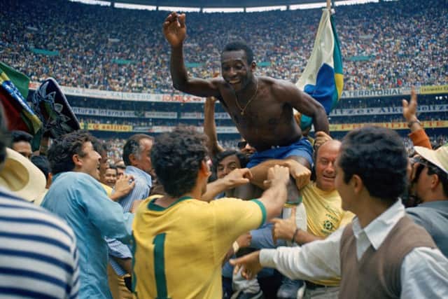 Pele is hoisted on the shoulders of his teammates after Brazil won the World Cup soccer final against Italy, 4-1 in 1970. Picture: AP