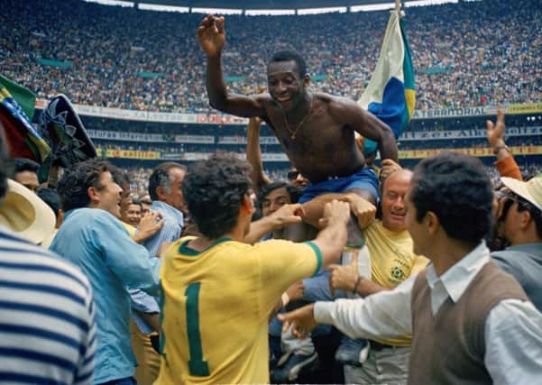 Pele is hoisted on the shoulders of his teammates after Brazil won the World Cup soccer final against Italy, 4-1 in 1970. Picture: AP