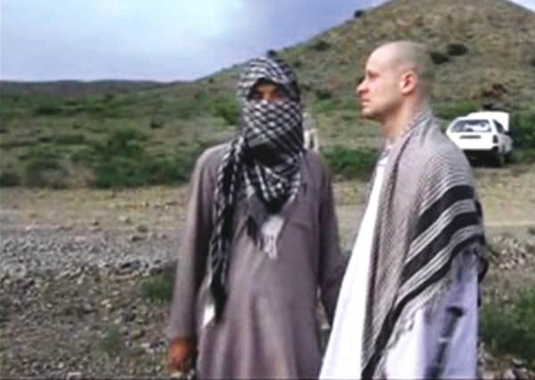 Sgt Bowe Bergdahl, right, stands with a Taleban fighter in eastern Afghanistan. Picture: AP