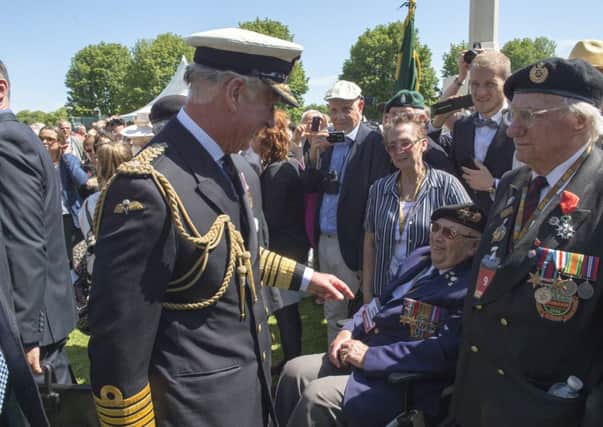 Prince Charles meets veterans at Bayeux Cemetery during the 70th commemorations of D-Day. Picture: Getty